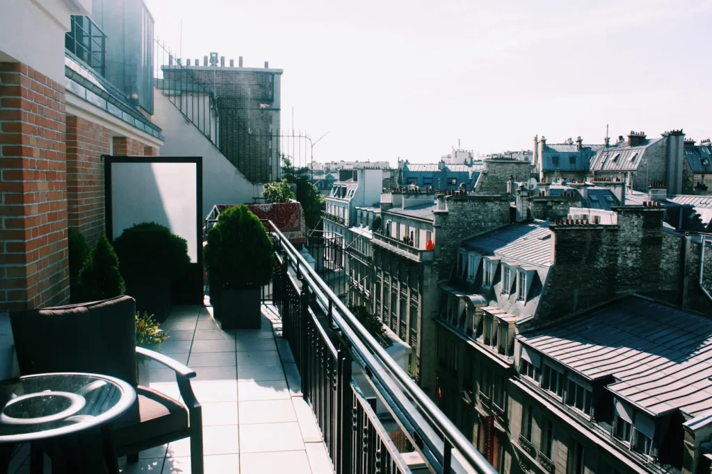 City rooftops and balcony chairs on bright day 2026 03 13 05 25 43 utc